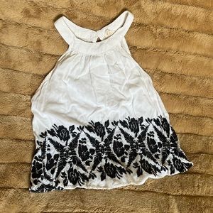 White top with black embroidered design